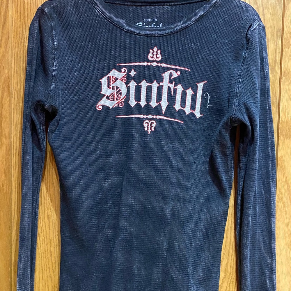 Sinful Women’s black thermal long sleeve shirt, size medium.